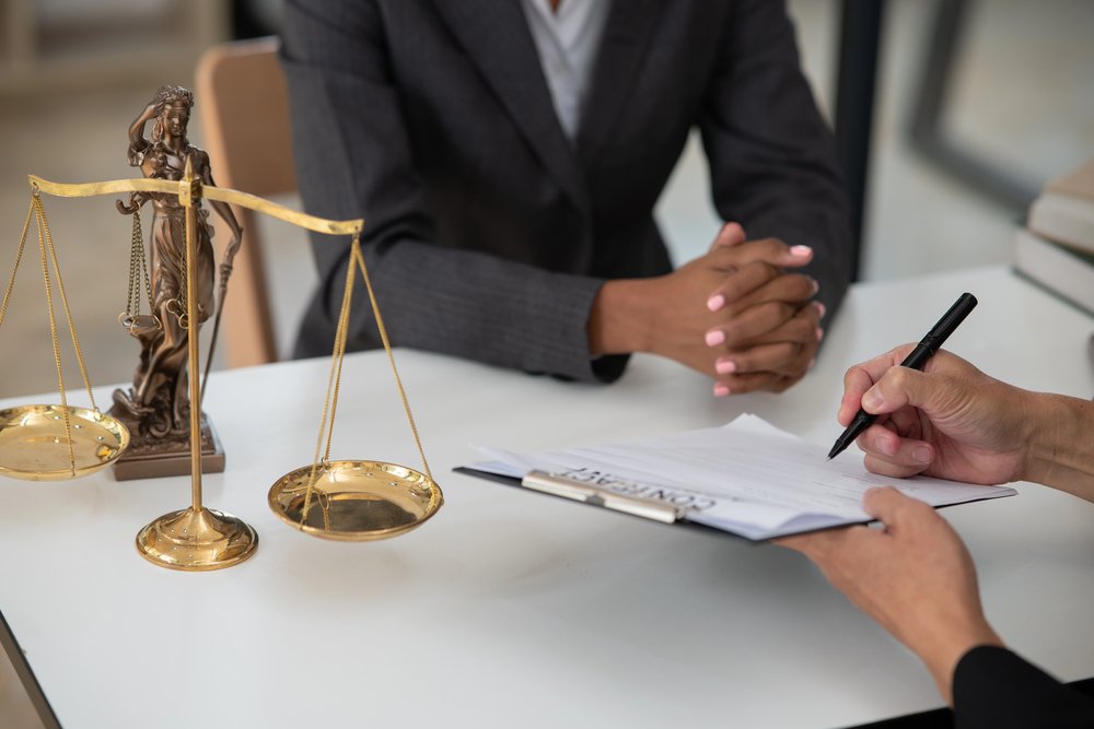 High-net-worth couple discussing divorce with a family lawyer.