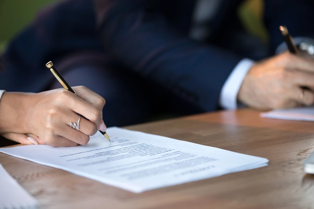 Lawyer drafting a prenuptial agreement for a business owner in New Jersey.