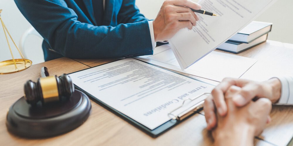 Legal expert reviewing valuation documents for intellectual property during a high-asset divorce.