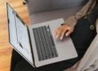 person typing on laptop.